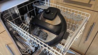 Instant Pot lid in the top rack of a dishwasher