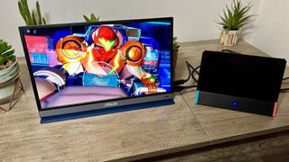 Asus ZenScreen OLED Portable Monitor with Nintendo Switch and Metroid Dread on the screen.