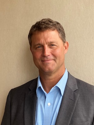 Headshot of Neel Bradham, Chief Executive Officer of Parador 