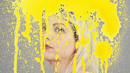 An illustration of a young woman&#039;s face has been painted over with bright splodges of yellow paint covering her face to depict brain fog