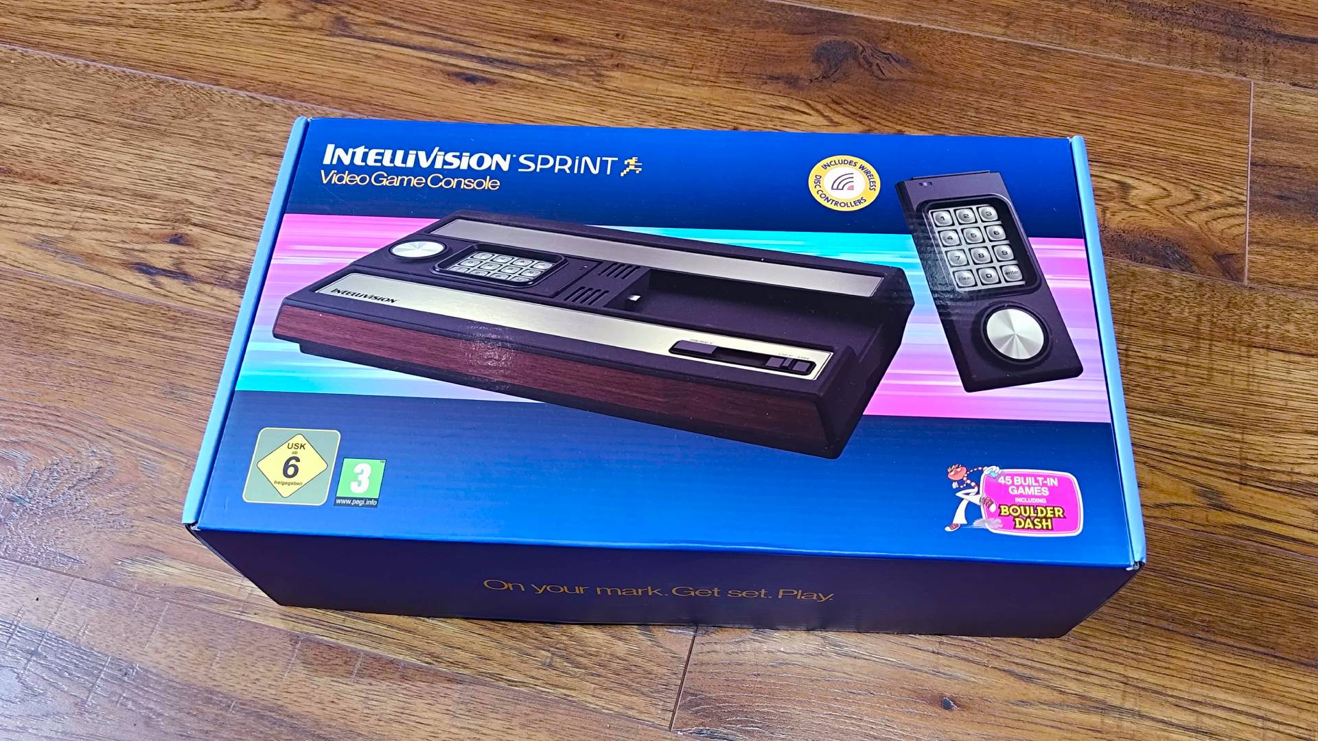 Intellivision Sprint box on woodgrain floor.