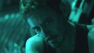 Robert Downey Jr looking tired and bathed in green light in Avengers: Endgame.