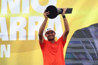 Eugenio Lopez-Chacarra holds the LIV Golf trophy aloft