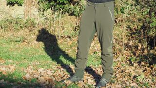 A man wearing green Endura MT500 Spray MTB pants