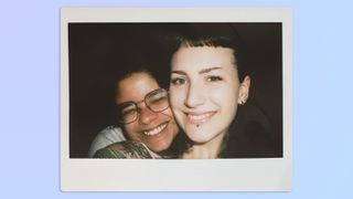 A selfie of two women, taken on a Fujifilm Instax Wide 400 instant camera