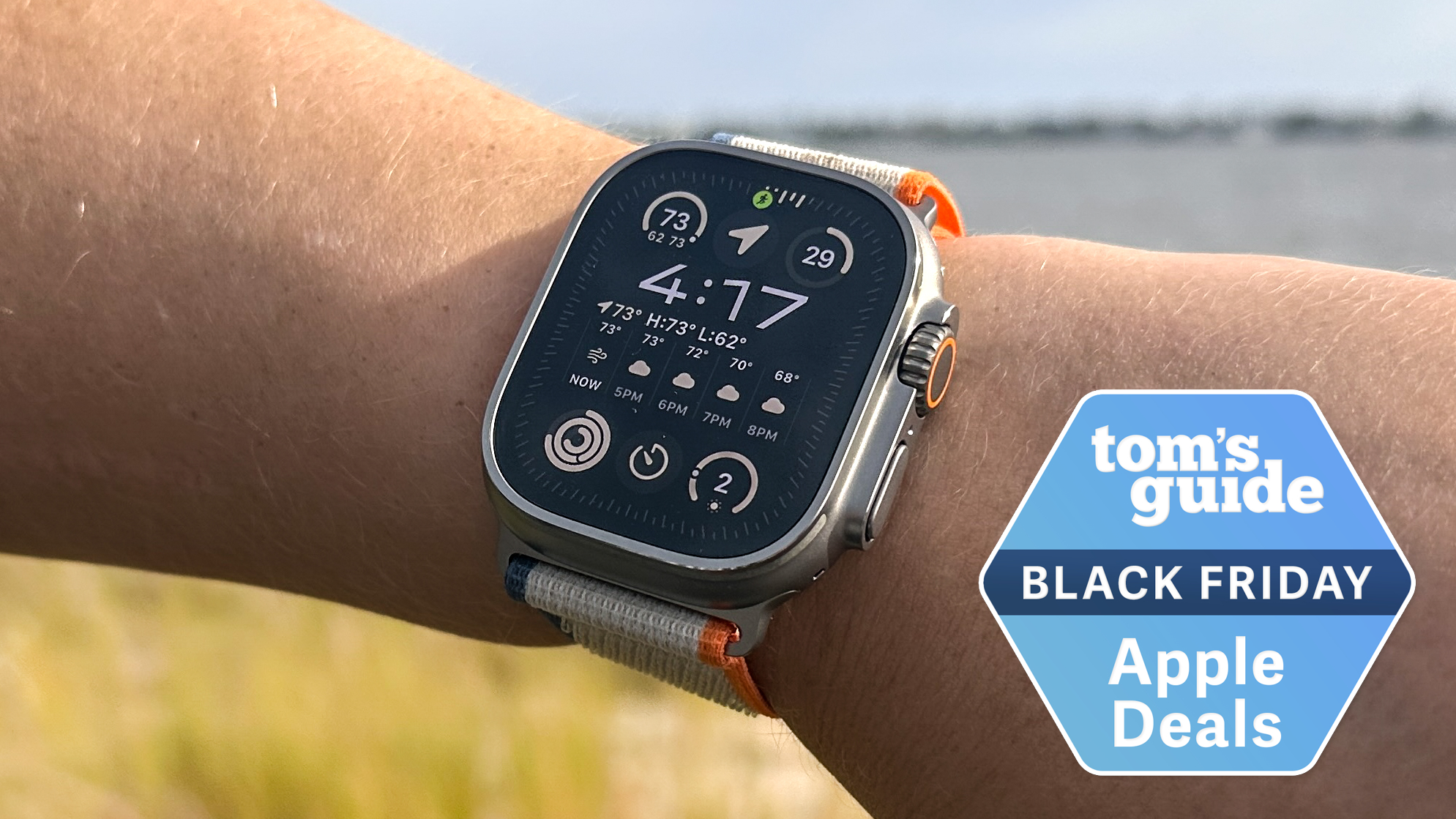An Apple Watch Ultra 2 on a person's wrist with a Tom's Guide Black Friday deals badge