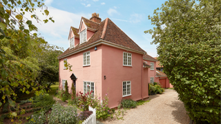 Pink 17th century farmhouse exterior in Suffolk.