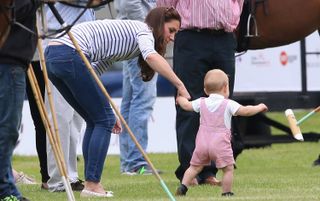 CIRENCESTER, ENGLAND - JUNE 15:Catherine, Duchess of Cambridge and Prince George of Cambridge attend the Royal Charity Polo during the Maserati Jerudong Trophy at Cirencester Park Polo Club o