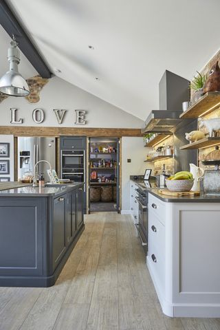 pantry beside large kitchen with island