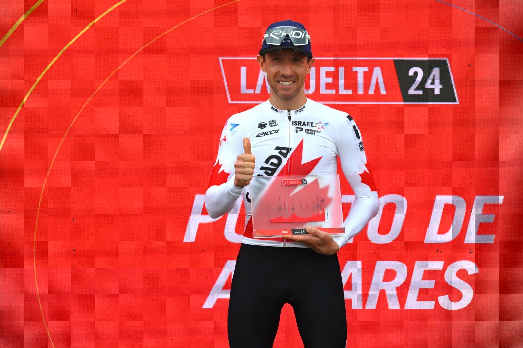 PUERTO DE ANCARES SPAIN AUGUST 30 Michael Woods of Canada and Team Israel Premier Tech celebrates at podium as stage winner during the La Vuelta 79th Tour of Spain 2024 Stage 13 a 176km stage from Lugo to Puerto de Ancares 1659m UCIWT on August 30 2024 in Puerto de Ancares Spain Photo by Tim de WaeleGetty Images