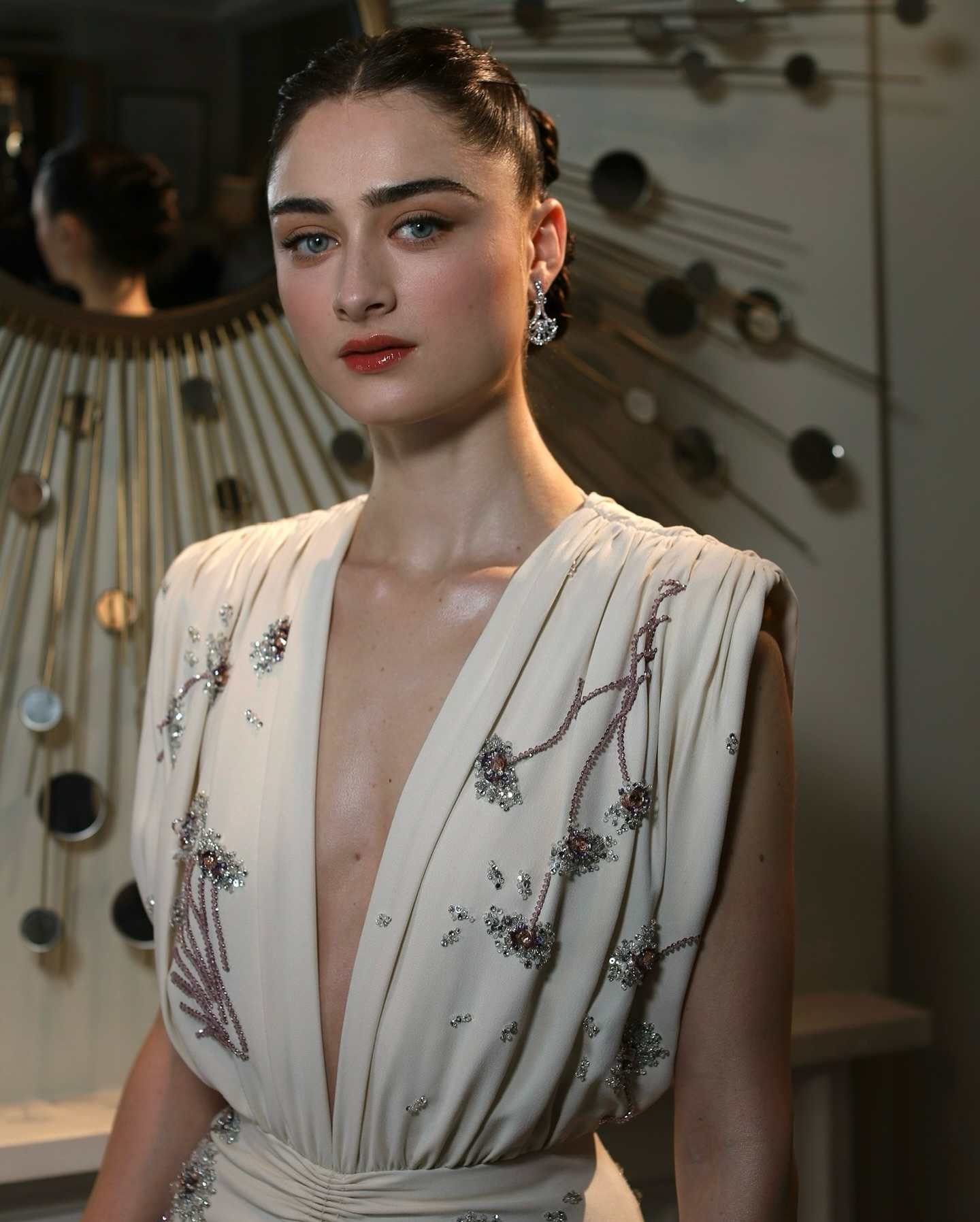 Images of Raffey Cassidy at the 2025 BAFTAS showing trends in eyebrow pencil makeup.