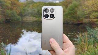 Xiaomi 15 rear panel, lake in background