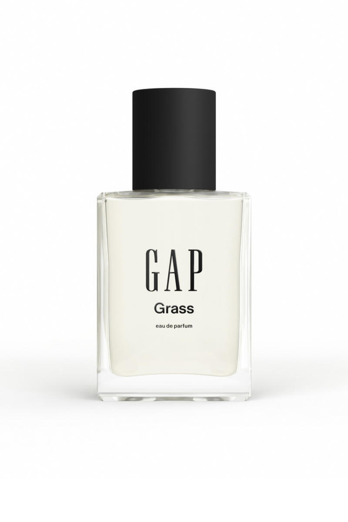 a clear glass bottle of Gap Grass perfume