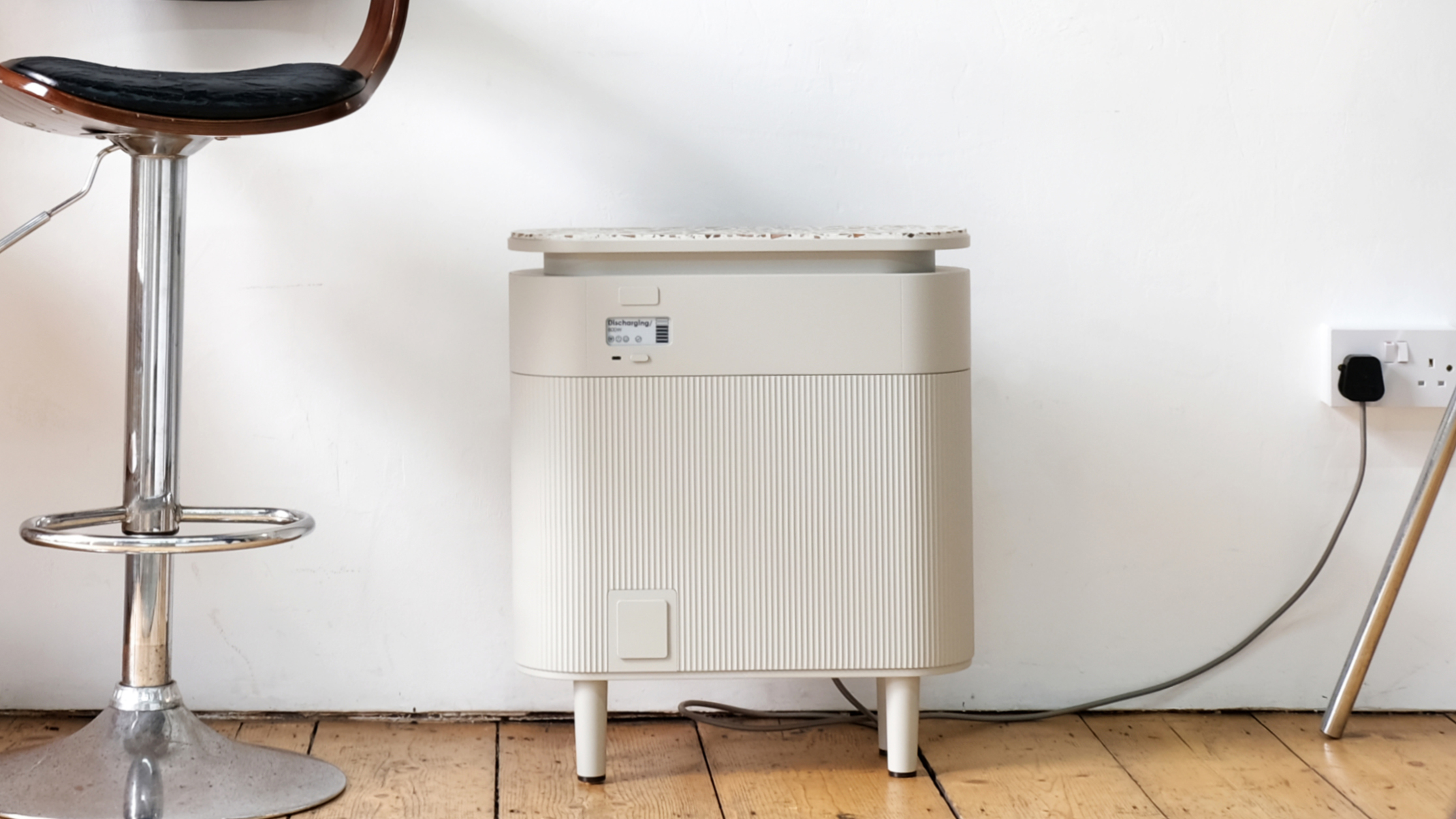 A Windfall Battery in a room plugged into a mains socket