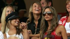 Cheryl Cole, Coleen Rooney and Victoria Beckham in the stands during a football match