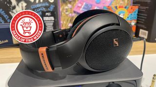 Sennheiser HD 505 wired headphones on their side, placed on a desk