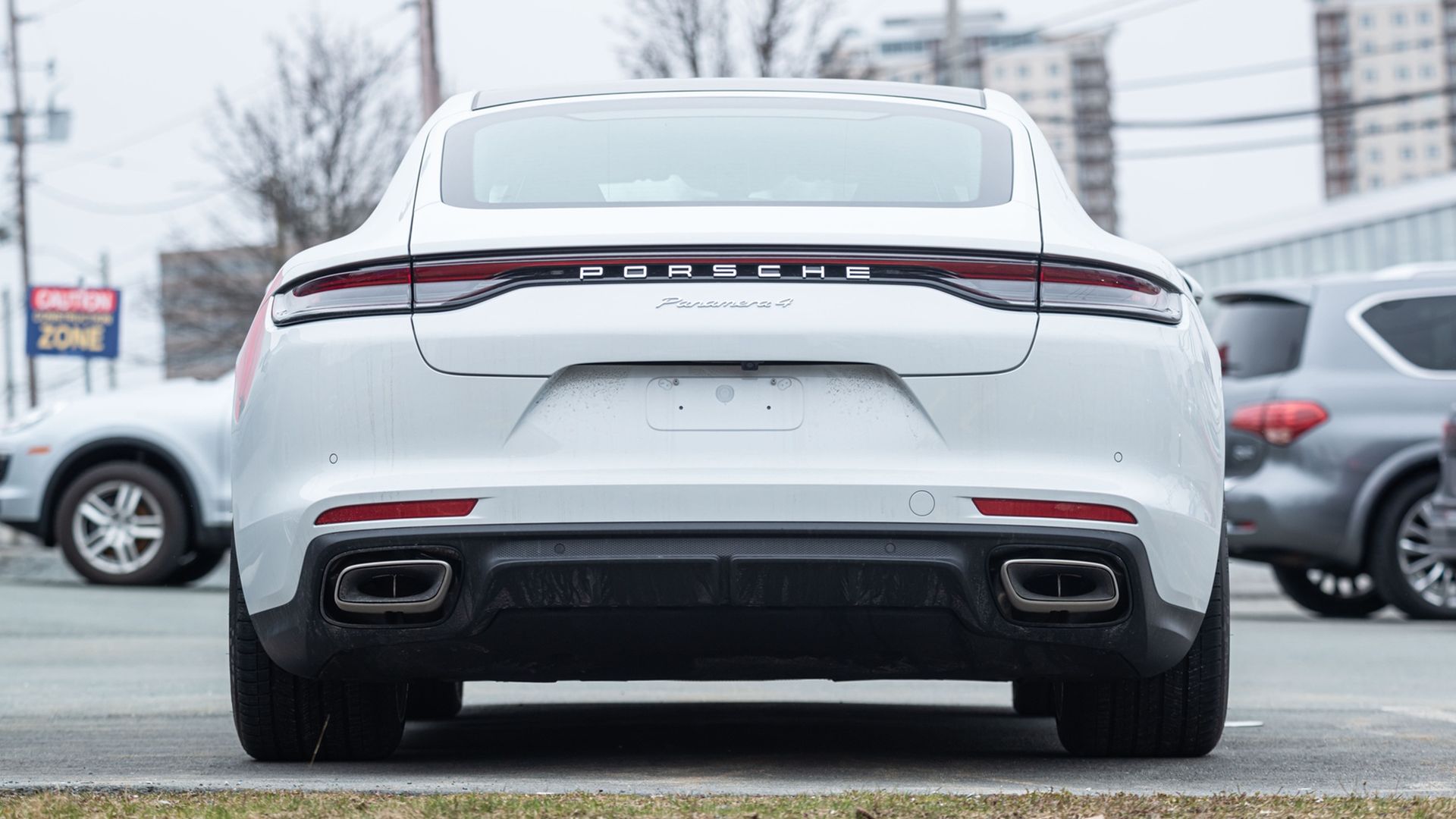 The back end of a white Porsche Panamera.