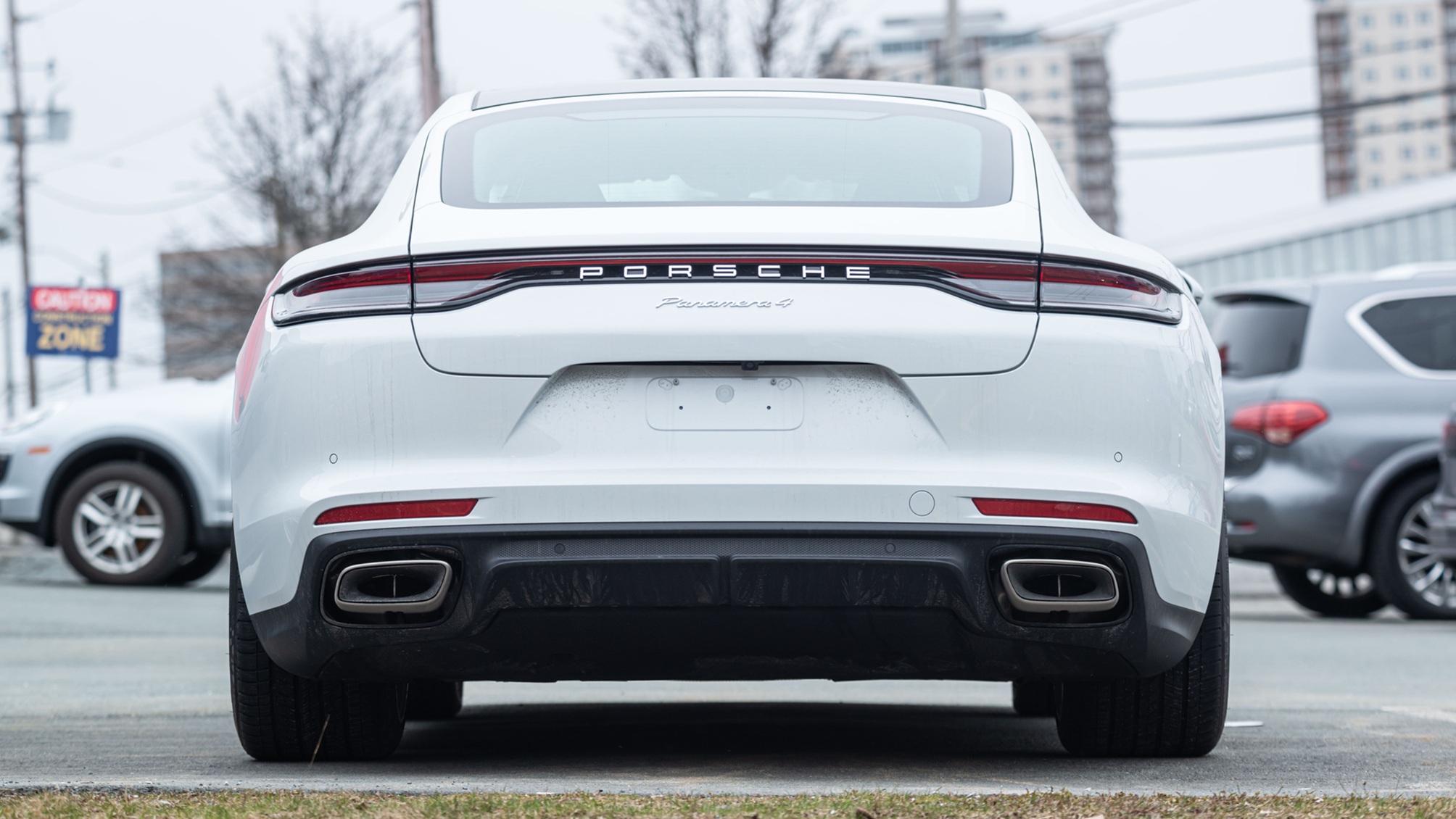 The back end of a white Porsche Panamera.