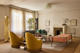 A living room with yellow chairs and luxurious elements