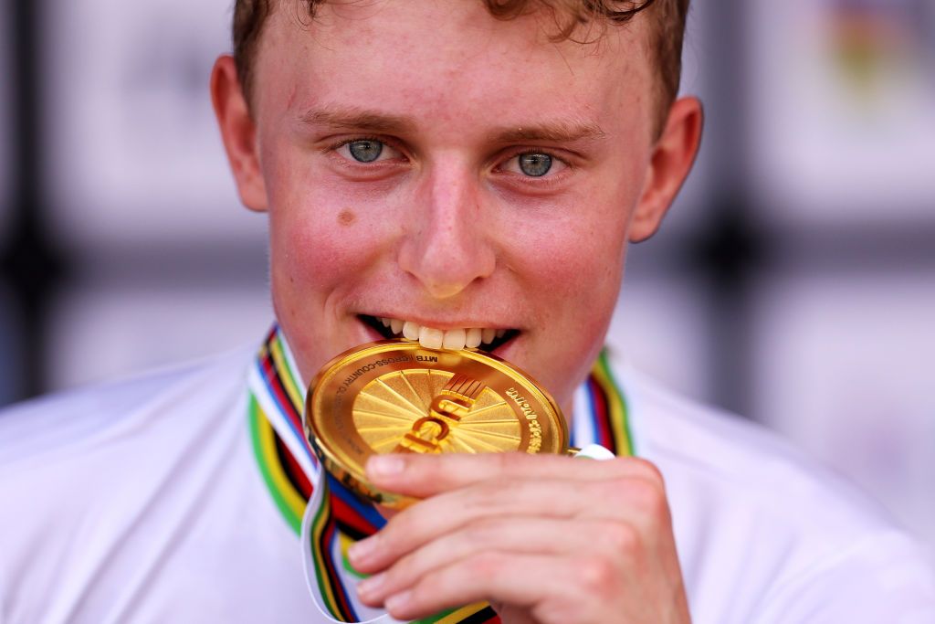 GLENTRESS FOREST PEEBLES SCOTLAND AUGUST 10 Gold medalist Albert Philipsen of Denmark celebrates winning during the medal ceremony after the Men Junior Crosscountry Olympic at the 96th UCI Cycling World Championships Glasgow 2023 Day 8 UCIWT on August 10 2023 in Glentress Forest Peebles Scotland Photo by Dean MouhtaropoulosGetty Images