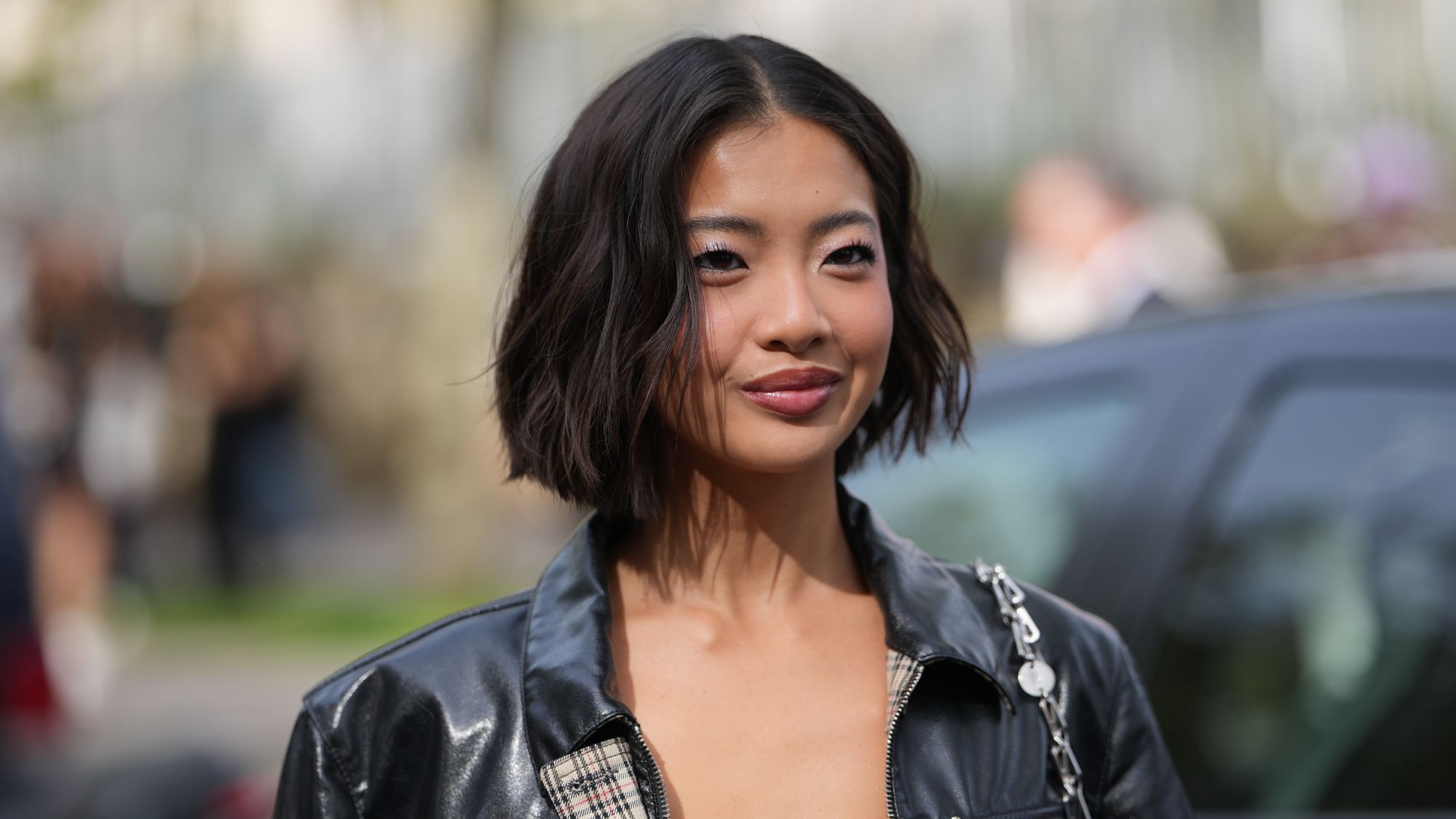 woman with short brown curled hair