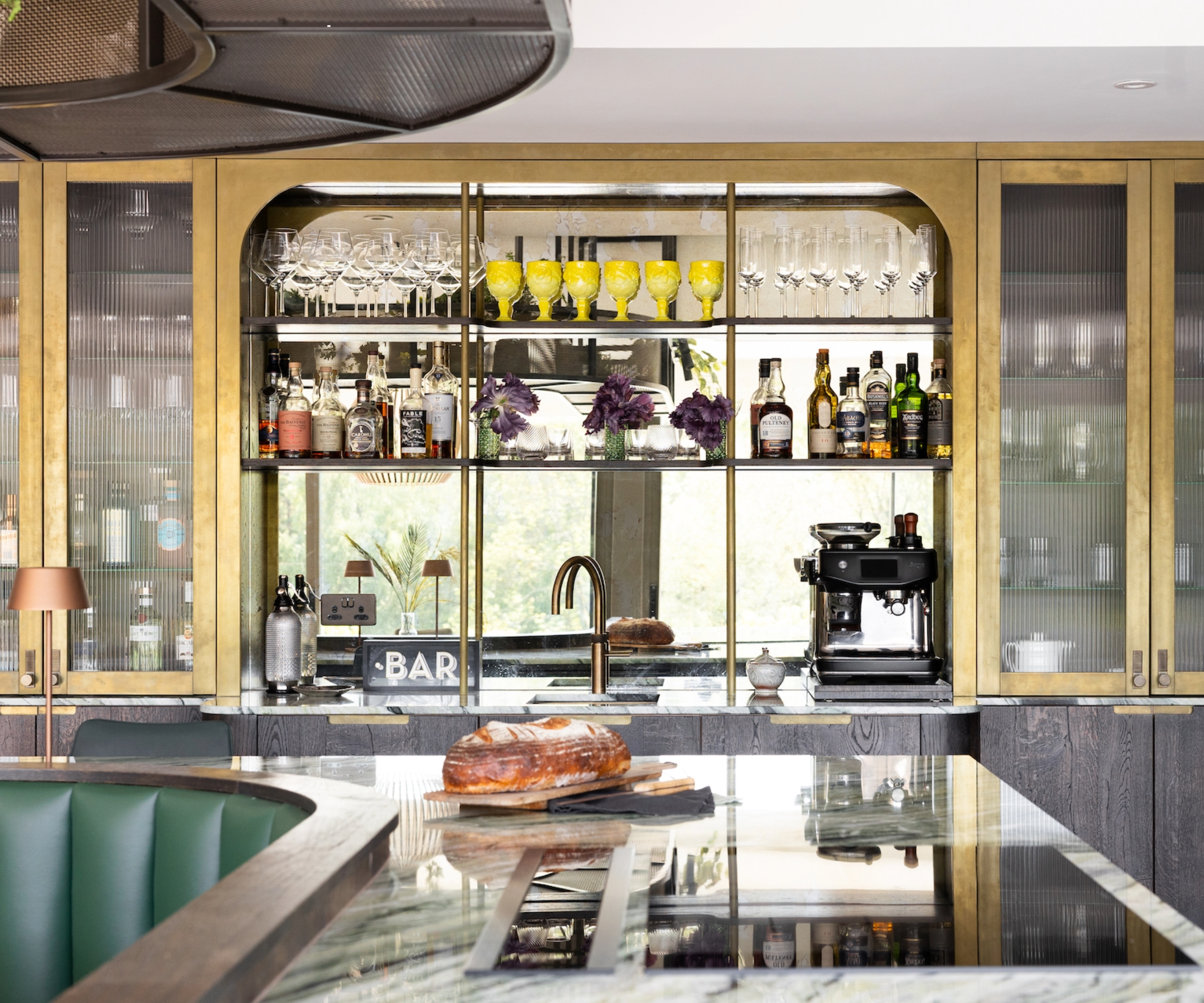 Built in storage idea with a custom drinks cabinet and shelf