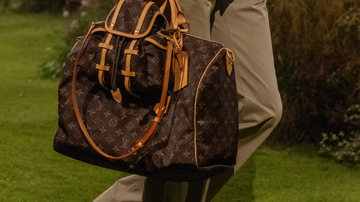 lv travel bag men's Louis Vuitton Keepall Bandoulire 35 Duffle The toiletry bag 2 compartments travel pouch is made from monogram eclipse coated canvas See Every Bag from The