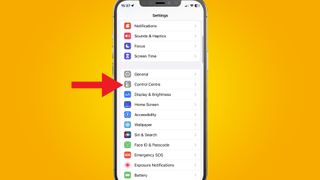 an iPhone on a yellow background with a red arrow pointing at the location of the Command Center settings