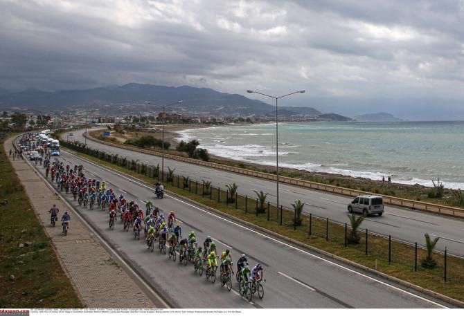 The stage started with overcast skies and wet roads