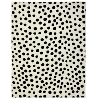 whited and black polka dot rug with white background