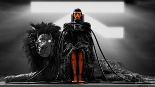 Marathon Introducing Traxus: Art of Traxus' liason sat in a chair with a lion next to them.