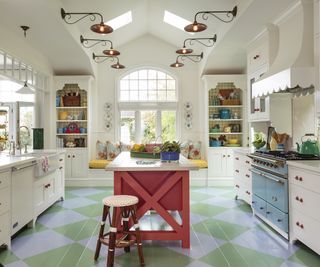 kitchen with red island and green flooring