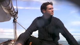 Jim Carrey sails in a boat.