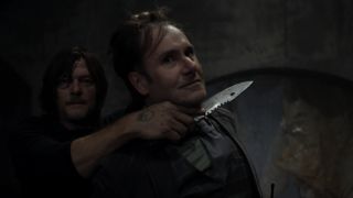 Daryl holding Hornsby at knifepoint in The Walking Dead