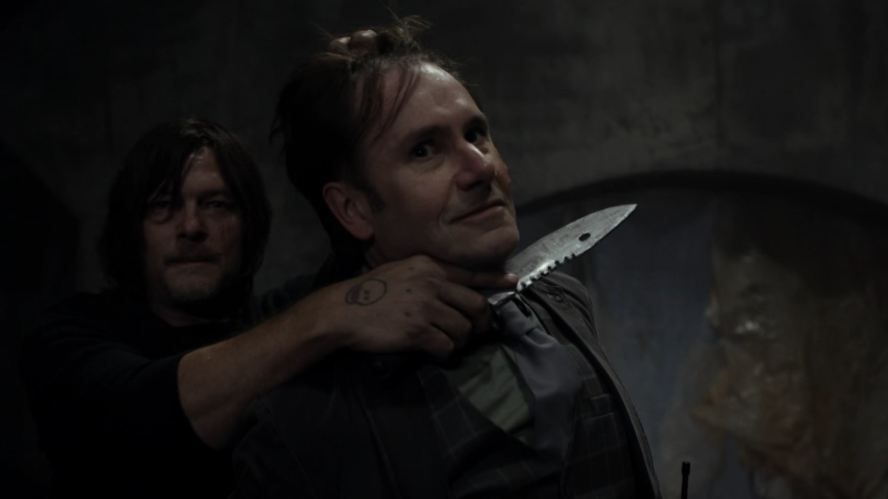 Daryl holds Hornsby at knifepoint in The Walking Dead