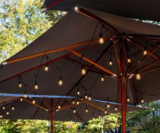 Solar lights under a patio umbrella