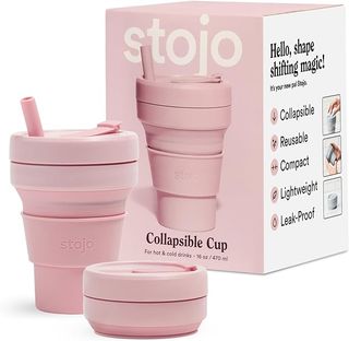 A pink Stojo cup standing up and one folded down