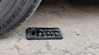 a pixel 8 being run over by a car for case testing