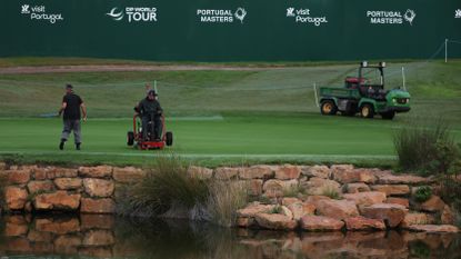 A greenkeeper cutting a green at the 2022 Portugal Masters