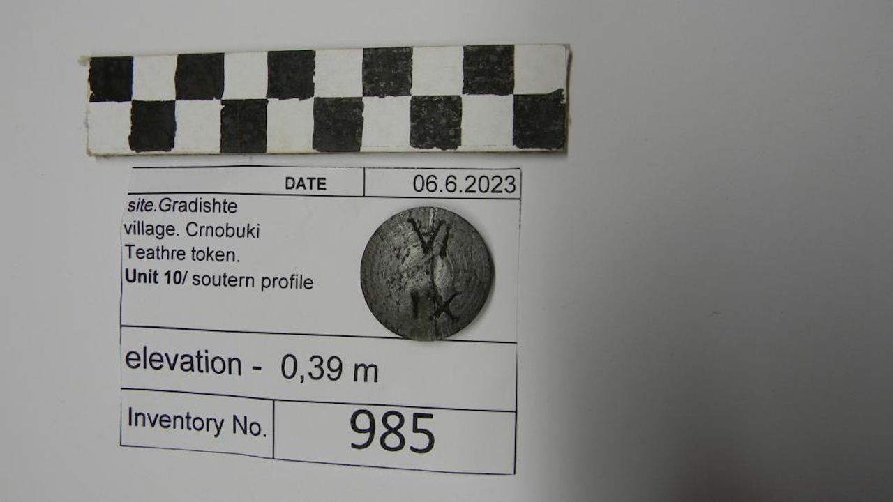 a close-up of a ceramic token