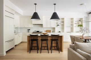 A white kitchen with silver hardware