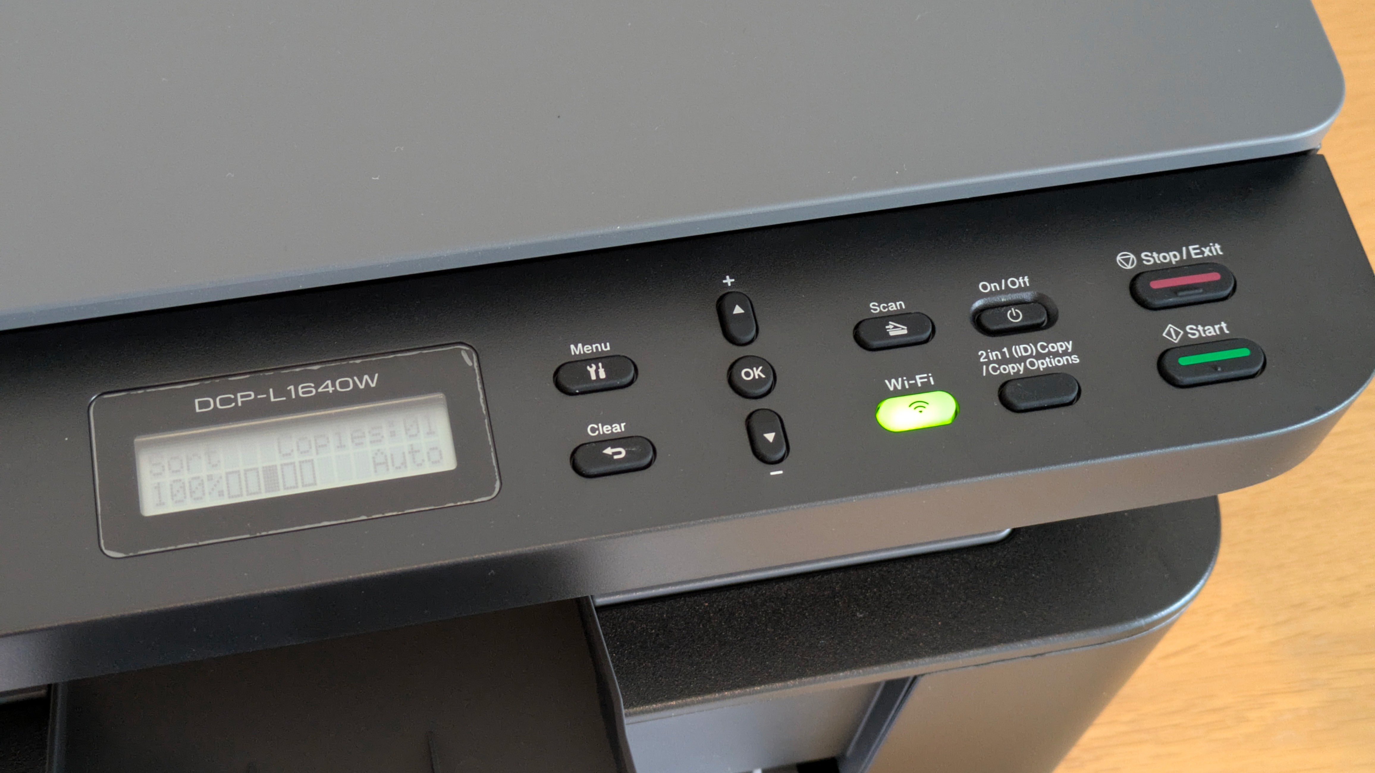 The Brother DCP-L1640W on a desk