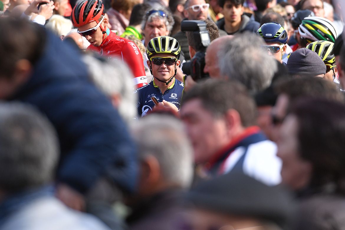Simon Gerrans dwarfed by the peloton