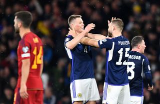 Scott McTominay and Ryan Porteous of Scotland celebrate victory after the UEFA EURO 2024 qualifying round group A match between Scotland and Spain at Hampden Park on March 28, 2023 in Glasgow, Scotland