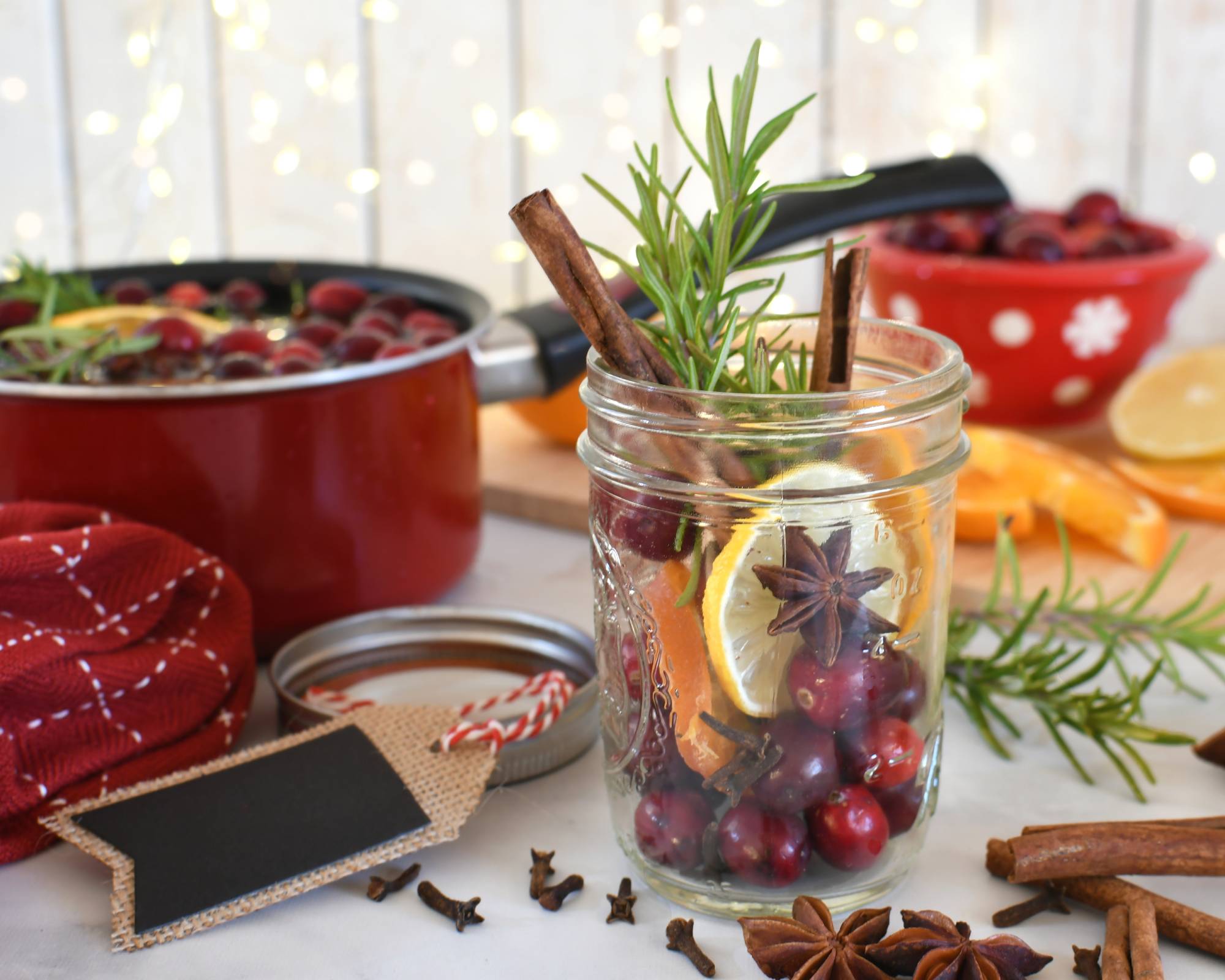 Rosemary and other ingredients for simmer pot in mason jar as gift