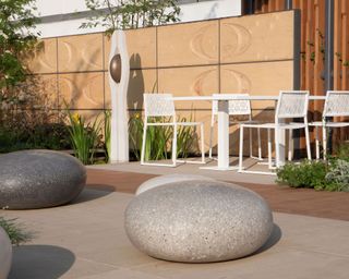 modern pebble sculptures on patio