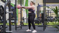 Woman performs a kettlebell swing