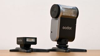 Godox iA32 product image, held in hand