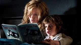 Essie Davis and Noah Wiseman reading a book in "The Babadook"