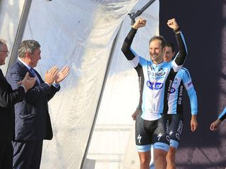 Tom Boonen leads his Omega Pharma Quick Step team onto the podium